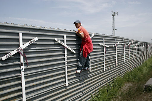 Aspiring migrant from Mexico into the US at the Tijuana-San Diego border