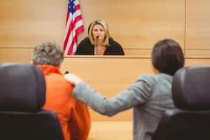 legal interpreting services in action - legal counsel interpreting the judge sentence to a prisoner