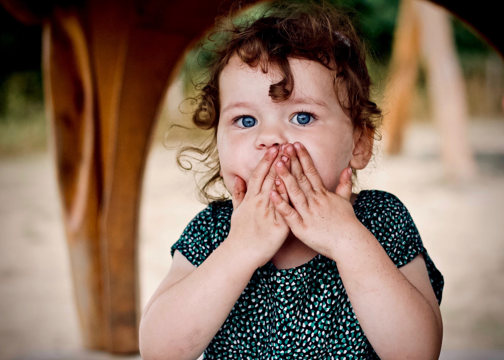 Little Girl Holding Her Lips